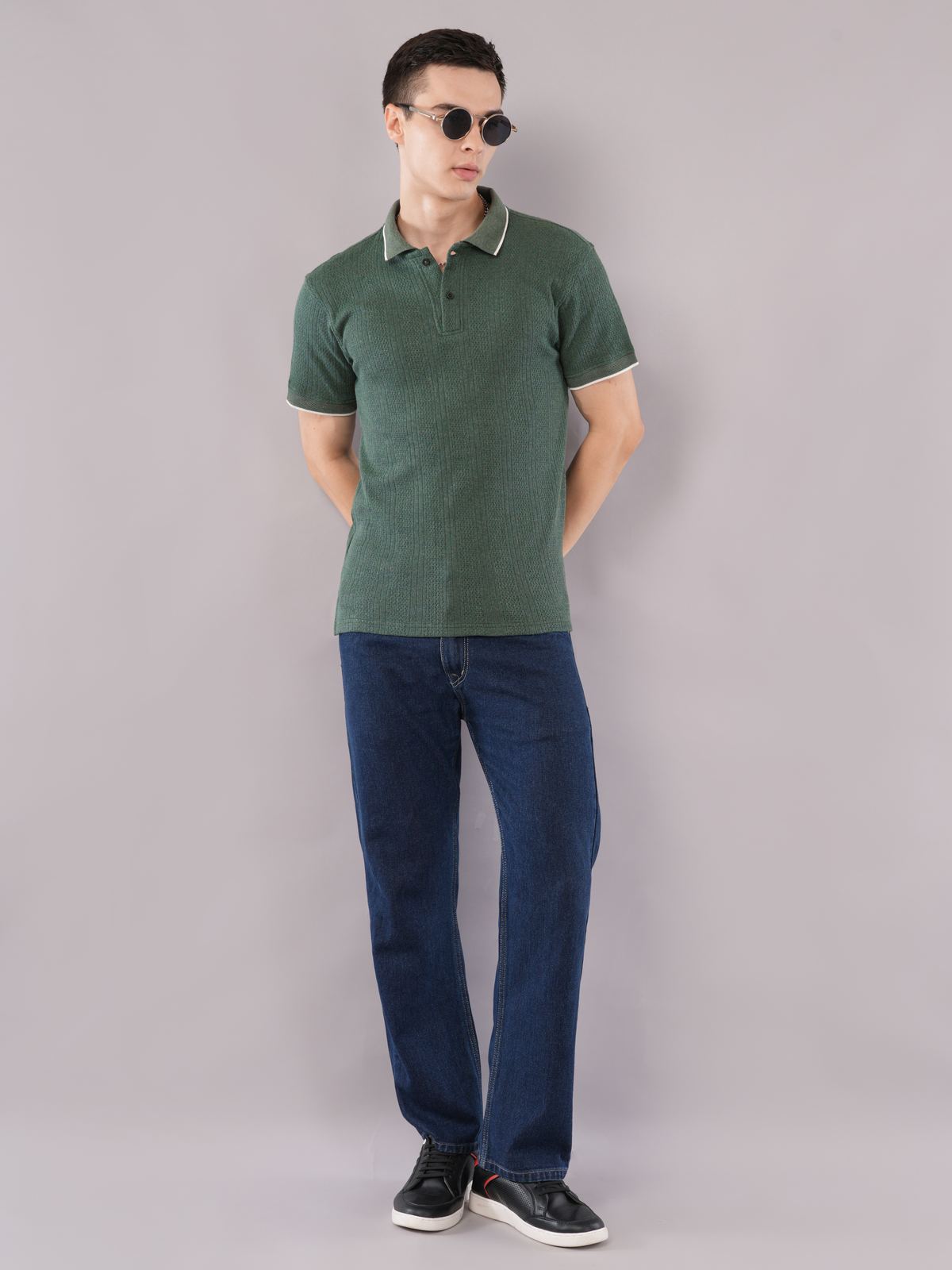 Model in the Forest Green Contrast Tip Polo with blue jeans and sunglasses